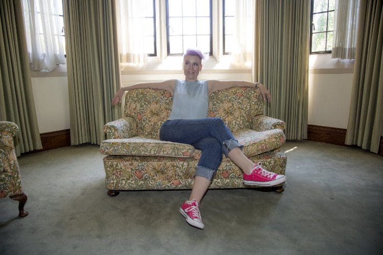 Shannon on the couch with red shoes